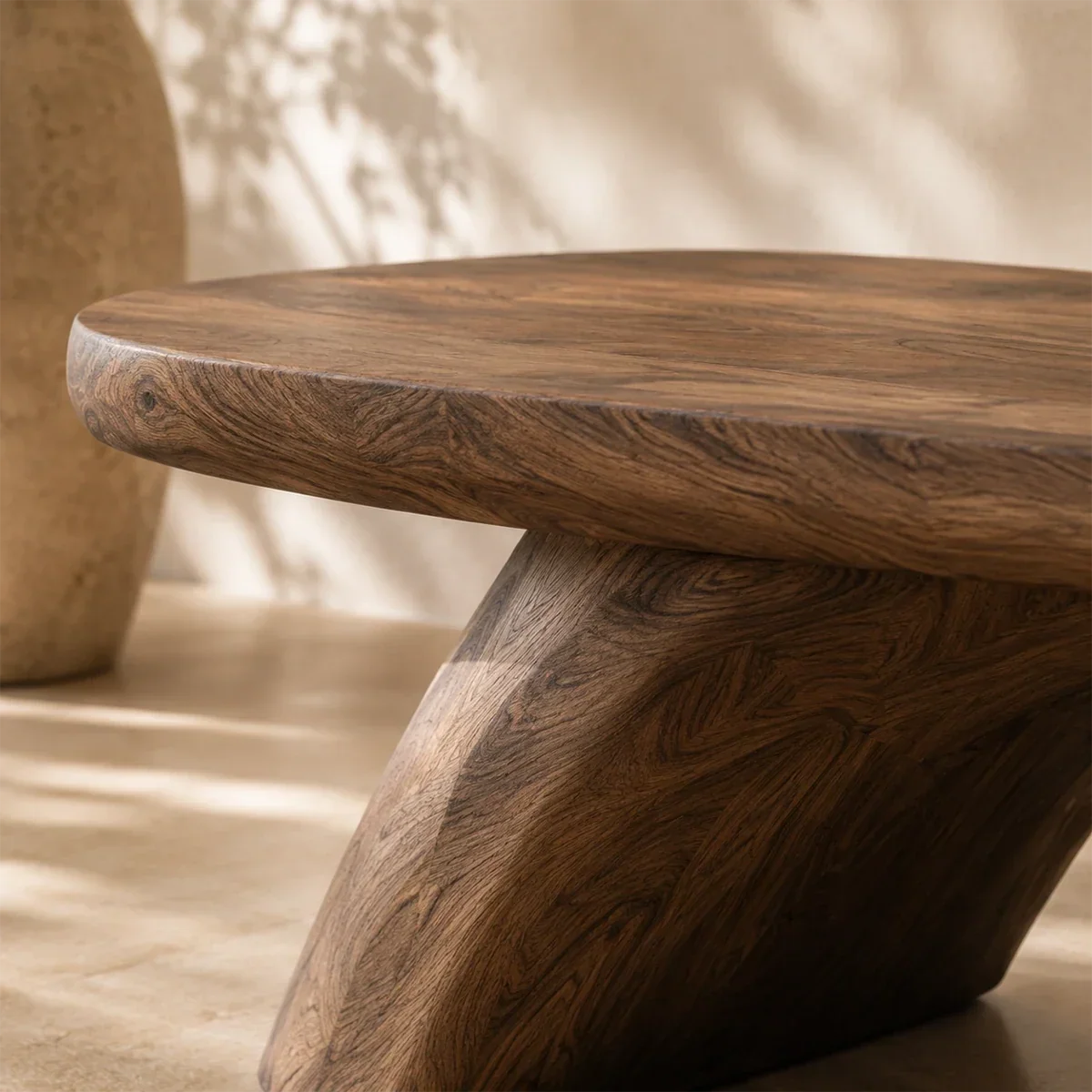 Handcrafted entry bench brings sculpted form and practical seating to a calm interior