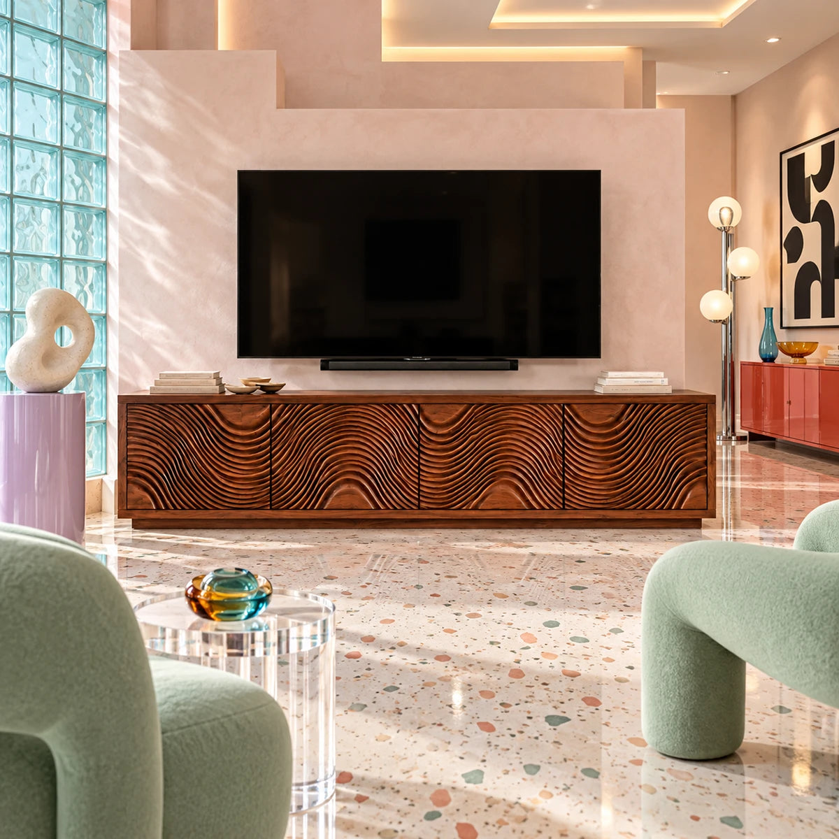 A living room TV stand in natural solid wood with sculpted doors and roomy storage