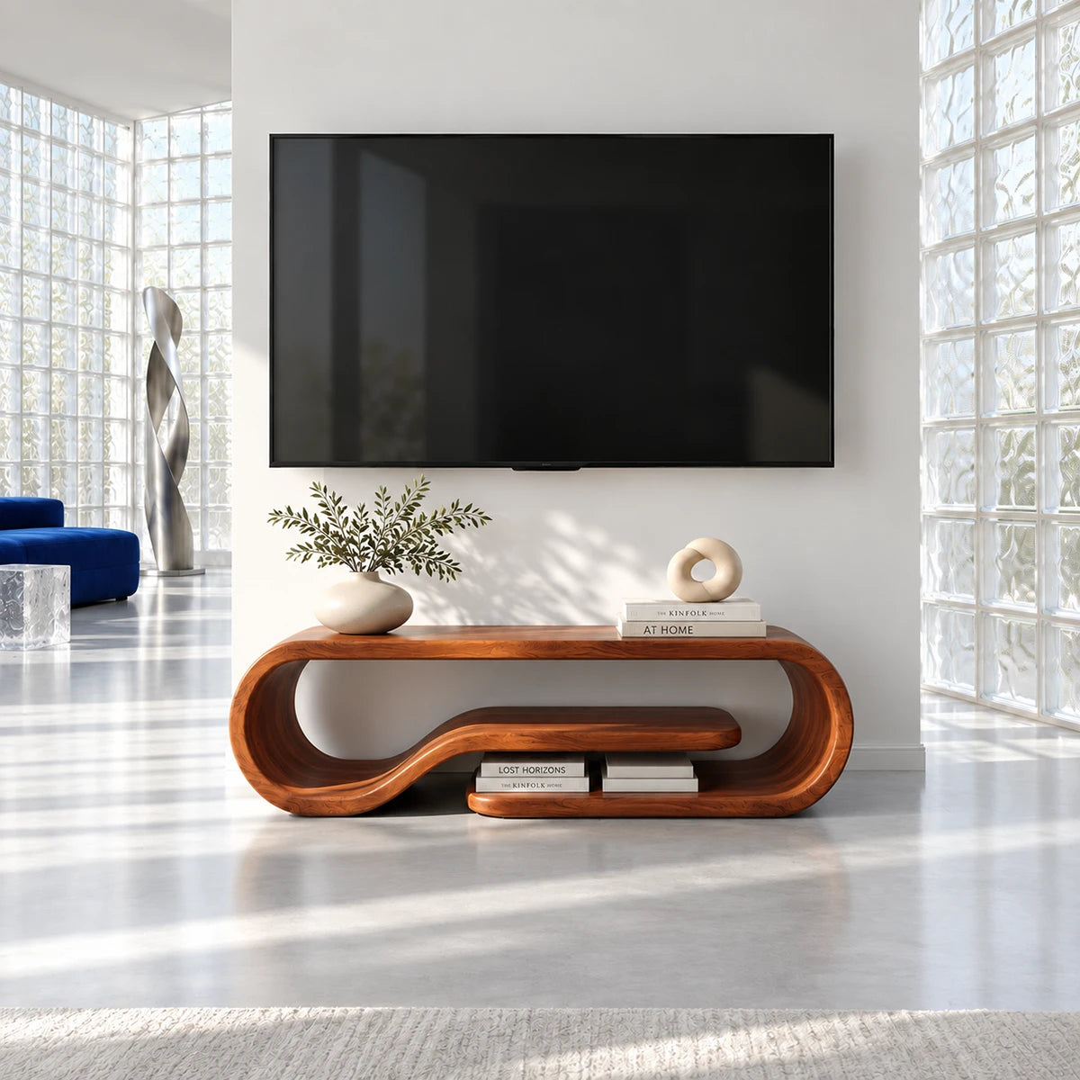 Statement media console in solid wood with sculptural sides and raised shelf design