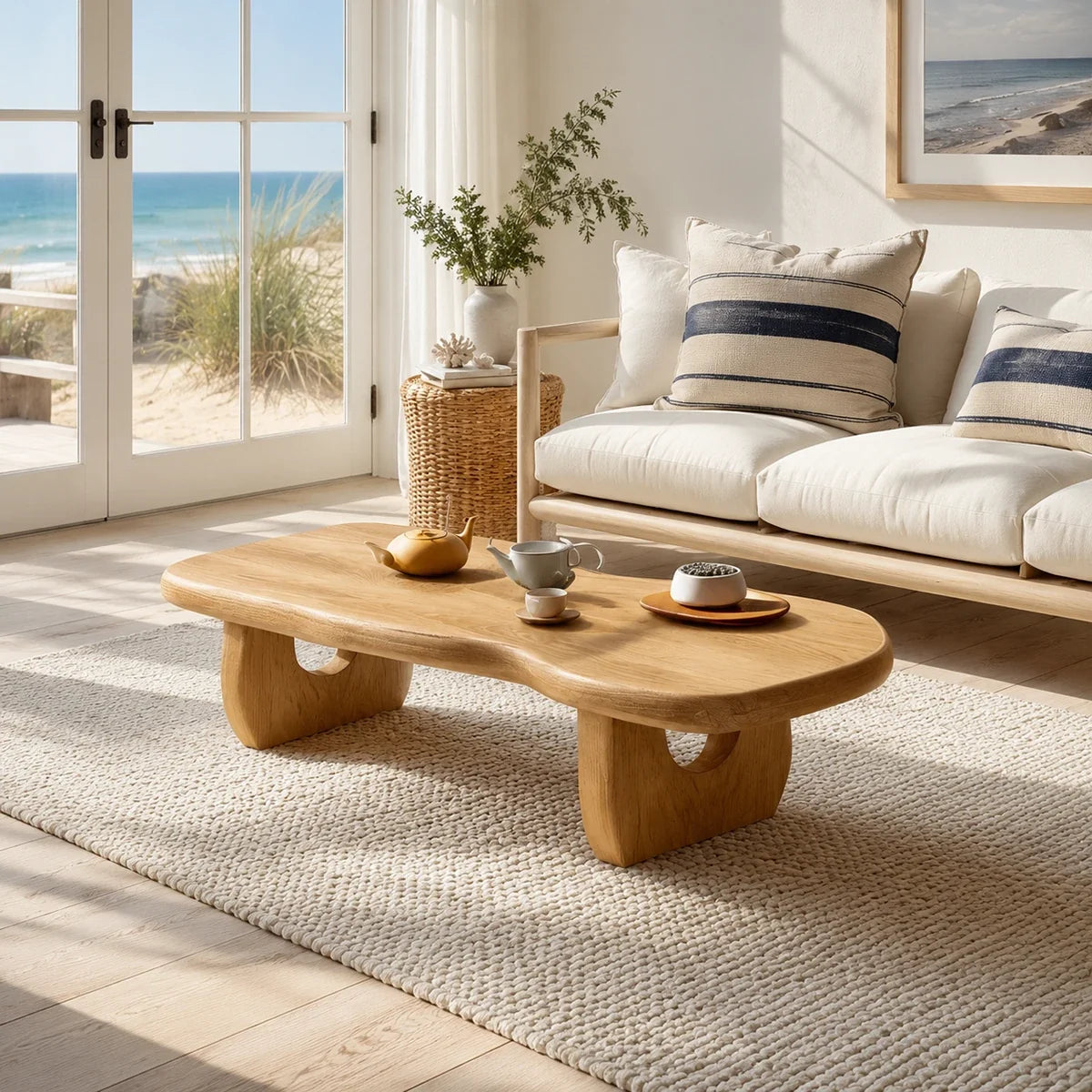 Statement coffee table with organic silhouette in a serene tropical living room setting
