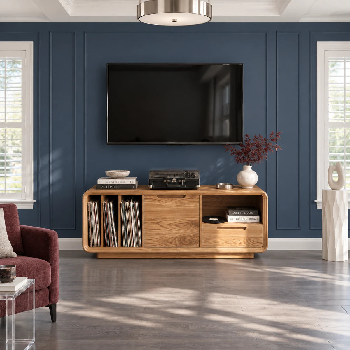 Open vinyl storage meets smooth drawer space in this solid wood TV media console