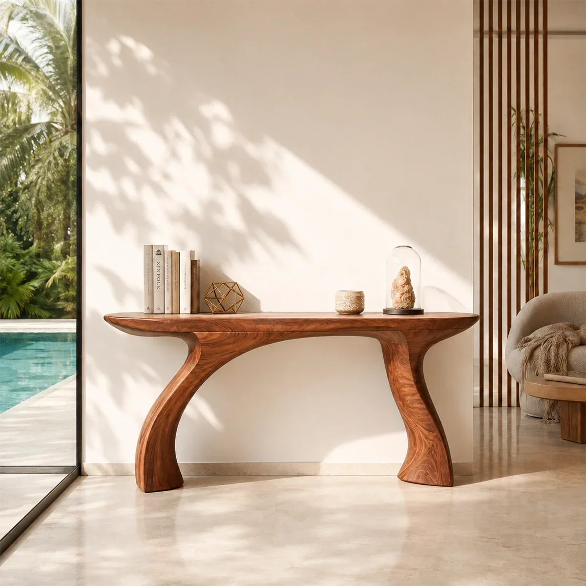 Contemporary console table showcases soft curves in a bright resort style room setting