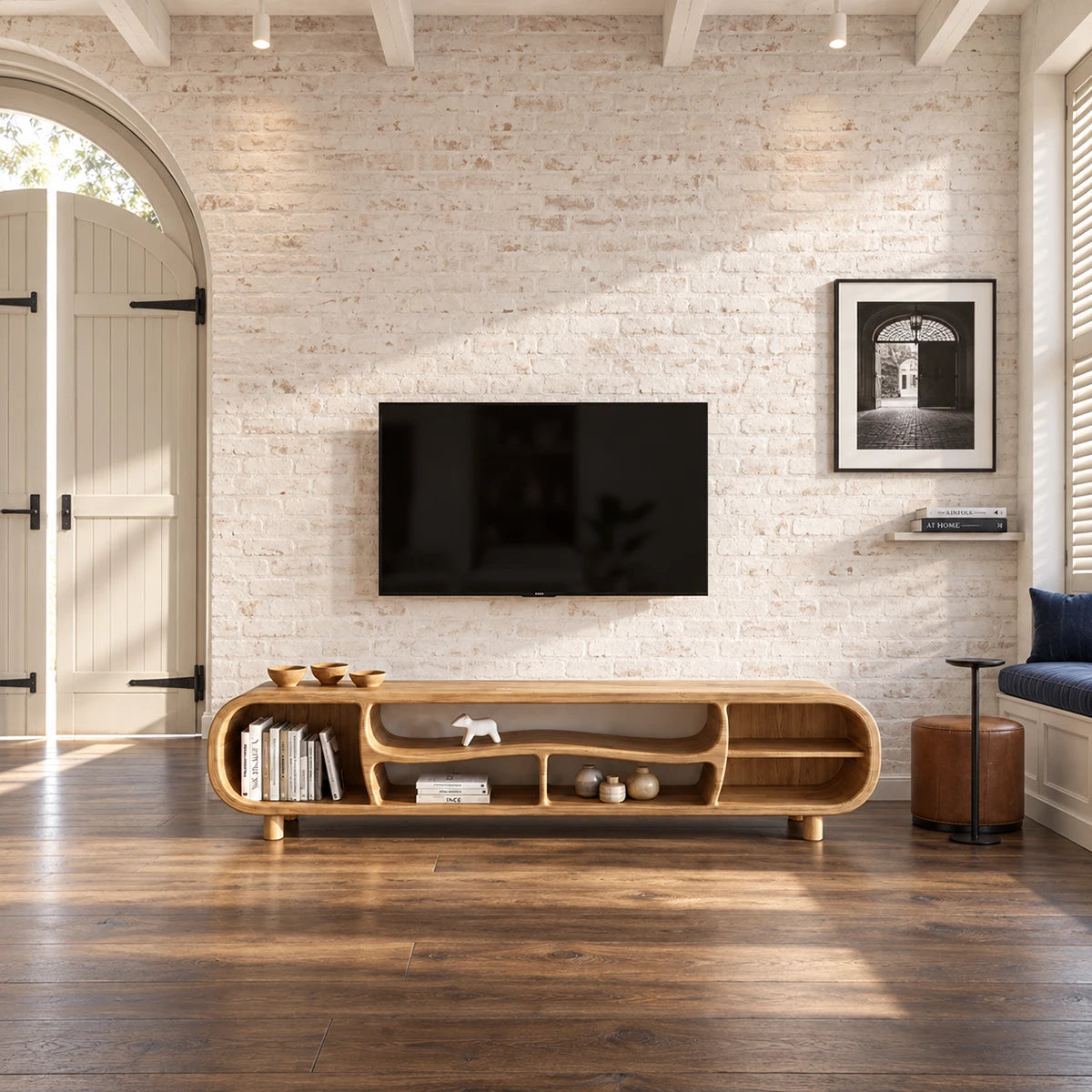 Living room TV stand in natural solid wood with sculptural cubbies and soft edges