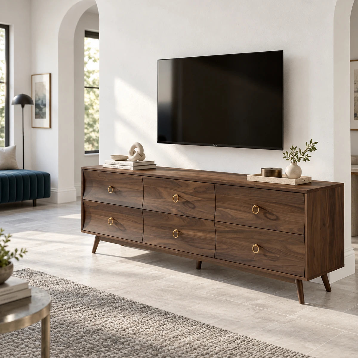 Six drawer TV cabinet in solid wood with brass ring pulls and tapered legs style