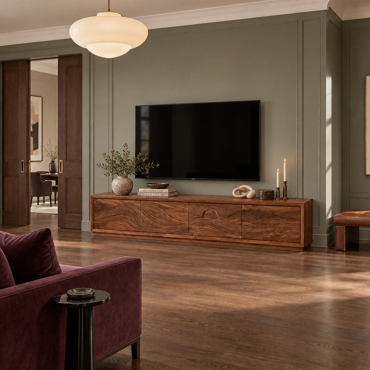 Designer entertainment unit in solid wood with scenic panel detailing and bold base