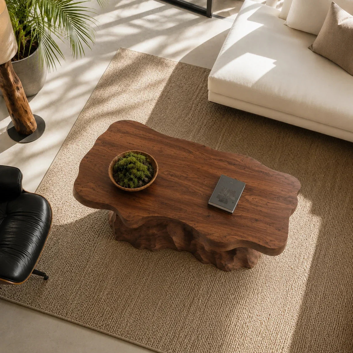 Modern coffee table with sculpted natural wood detailing in a refined tropical space