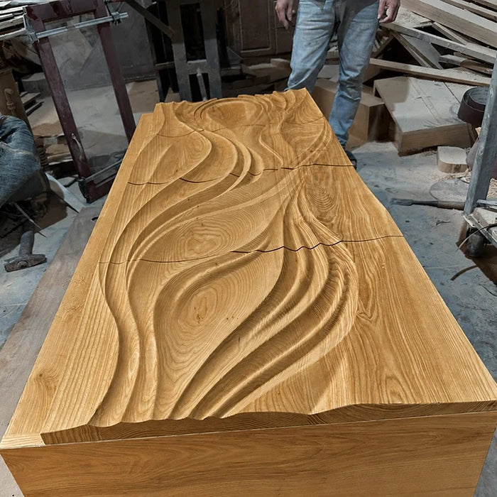 Close-up of hand-carved wave relief on a solid wood panel by Arboriswood