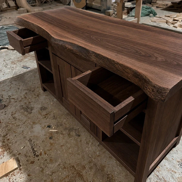 Arboriswood dark solid wood cabinet with live-edge top and open drawers in the workshop