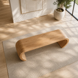 Minimalist bench with seamless curved supports and broad seat for calm contemporary rooms