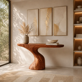 Entryway console table featuring a sculpted base and broad display surface for decor