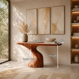 Statement console table blends organic form and warm wood tone in minimalist interiors