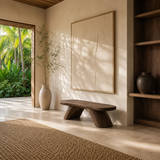 Organic modern bench features a broad seat and angled supports in warm natural light