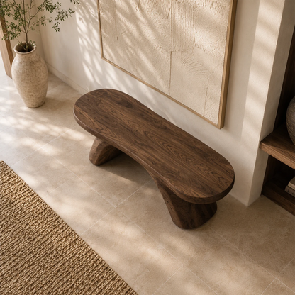 Modern accent bench with asymmetrical supports complements a refined neutral hallway