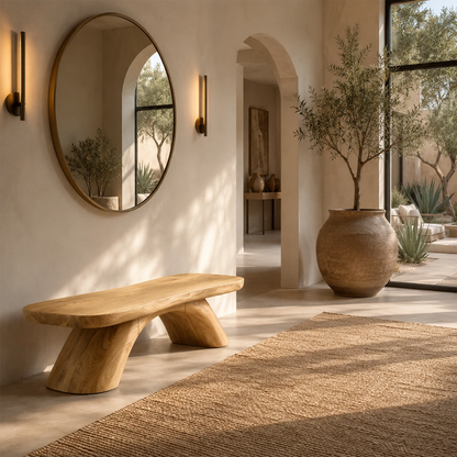 Artisan wood bench showcases a thick seat and architectural legs beside textured art