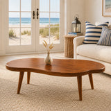 Premium coffee table with a freeform silhouette and slender legs for refined casual spaces