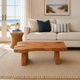 Premium coffee table with natural contours and a low solid wood base for airy interiors