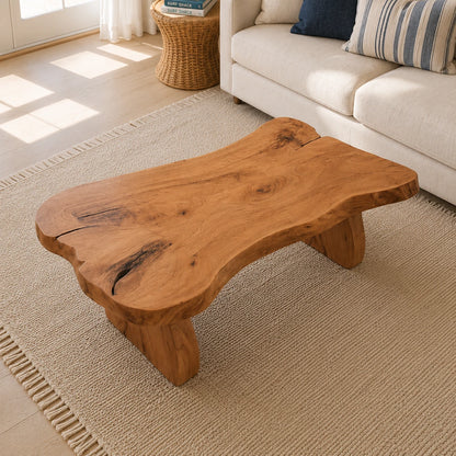Low profile coffee table with raw edge detail and wide solid wood legs for calm interiors