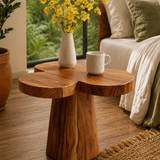 Accent end table featuring a flower shaped top and tapered pedestal base for bedside use