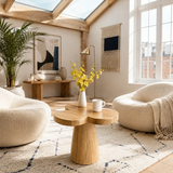 Statement end table with clover inspired top in a calm biophilic bedroom setting