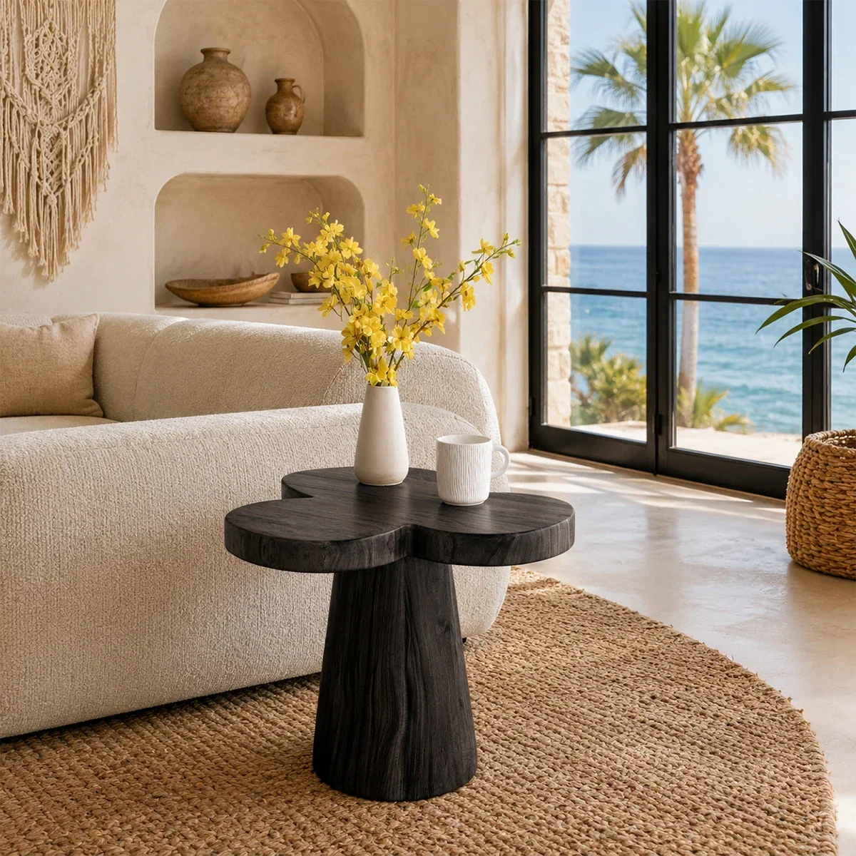 Luxury side table with organic top and sculpted pedestal base beside a modern bed
