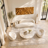 Statement wood wall art showcasing organic carved blooms in a luxe neutral room