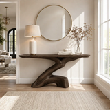 Sculptural console table with branching pedestal base in a bright modern entryway