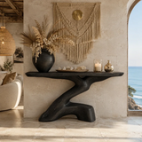 Curved console table displayed with minimal decor in a warm contemporary interior