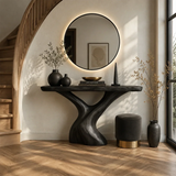 Curved console table displayed with decor in a luxury room overlooking tropical views