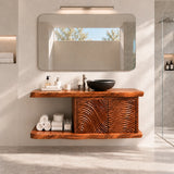 Clean lined vanity unit in natural solid wood with carved panels and floating shelf