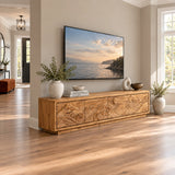 Sculptural entertainment center in solid wood with carved waves and hidden storage
