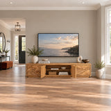 Designer media cabinet in solid wood with artful relief doors and wide silhouette
