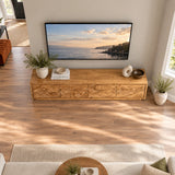Statement TV cabinet in solid wood with coastal carving and streamlined storage design
