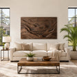 Carved landscape wall art with layered mountain relief adds depth to a modern living room