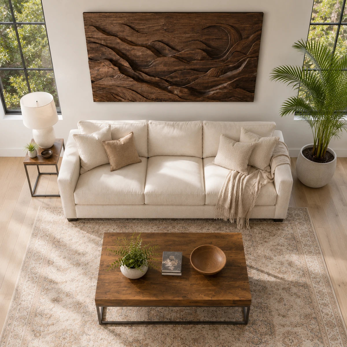 Sculptural wall panel above seating adds movement through sweeping landscape forms