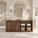 Open shelf bathroom vanity in natural solid wood with leaf doors and basket cubbies