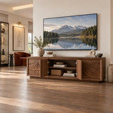 Designer media cabinet in solid wood with artful carved fronts and roomy storage
