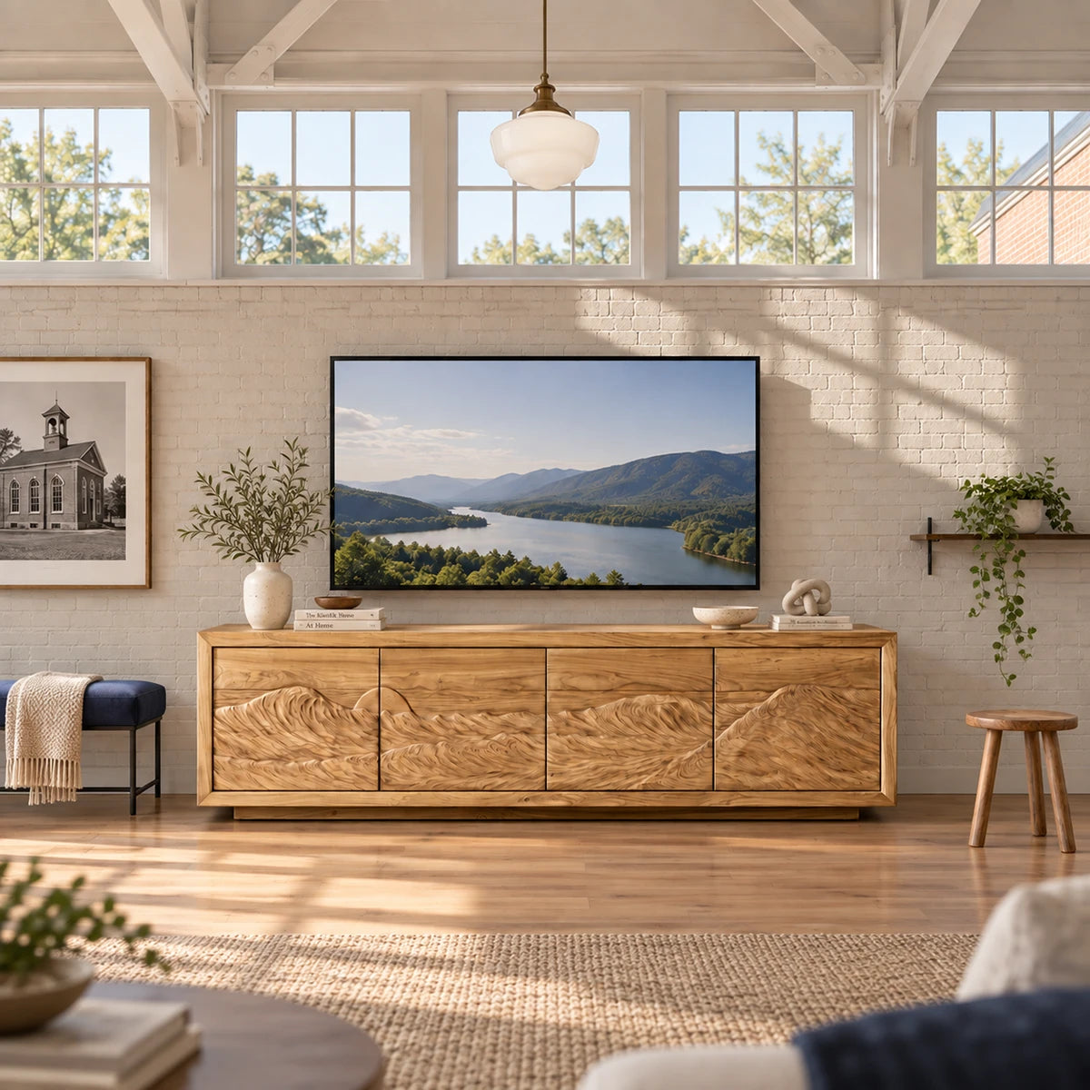 Architectural media unit in solid wood with wide stance and carved panel detailing
