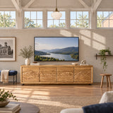 Architectural media unit in solid wood with wide stance and carved panel detailing
