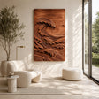 Vertical wall sculpture with curling wave forms creates depth in a modern interior
