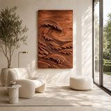 Vertical wall sculpture with curling wave forms creates depth in a modern interior
