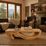 Set before classic leather seating, this coffee table adds sculptural balance to the room