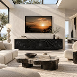 Decorative TV cabinet with carved front panels creates a distinctive media wall feature