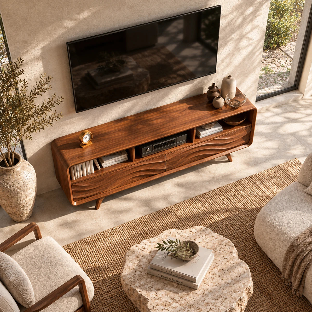 Wide entertainment unit with carved wave panels and open storage for living room media