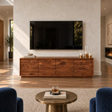 Curated entertainment unit in solid wood with wave-pattern fronts and slim framing
