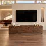 Sleek entertainment console in solid wood with a scenic carved front and low profile
