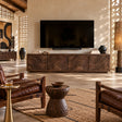 Natural solid wood TV stand with four carved doors and sculpted wave texture detail