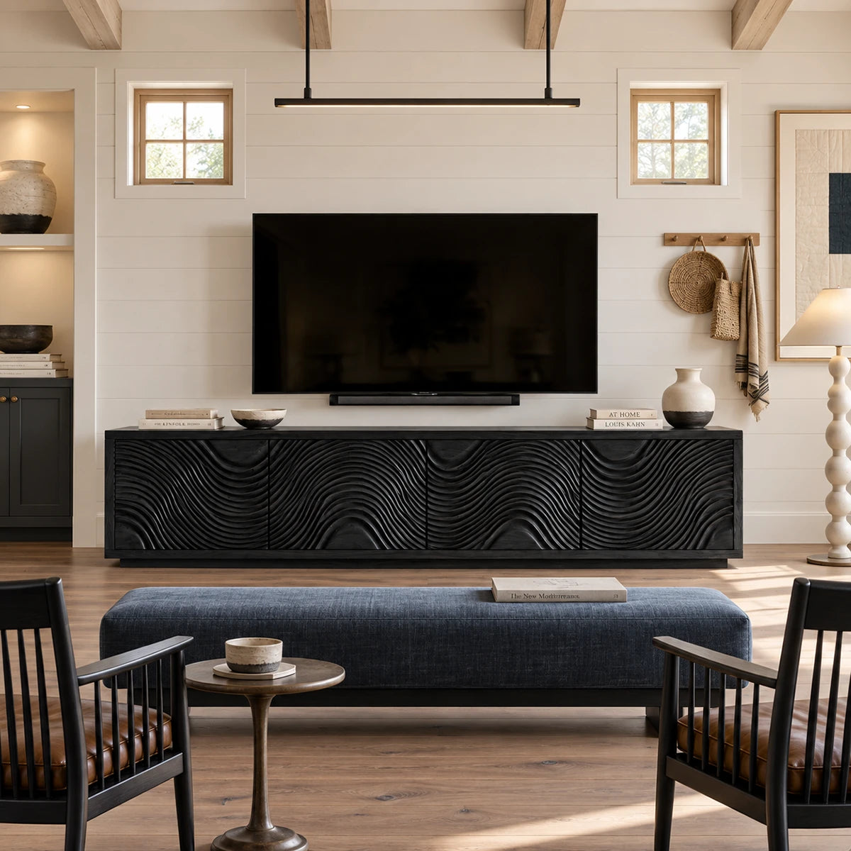 Low TV stand in natural solid wood with four panel doors and sculpted texture detail