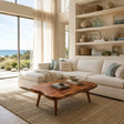 Handcrafted solid wood coffee table with live edge top and tapered legs in a coastal room