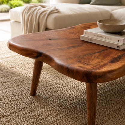 Organic shape coffee table featuring a solid wood top and soft irregular edge detailing