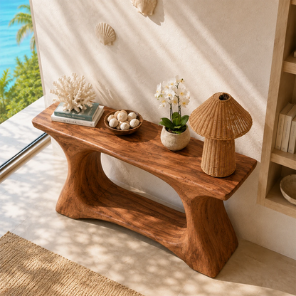 Narrow console table with a sculpted open base for refined foyer decor styling indoors